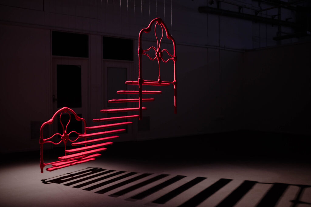 Celline Mercado, Dismantled Bed II, 2024, bedframe wrapped in acrylic wool, stainless steel wire rope, dimensions variable